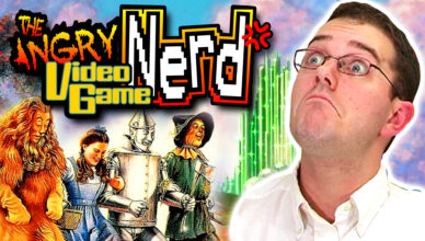 The Angry Video Game Nerd thumbnail for his Wizard of Oz review, featuring the Cowardly Lion, Dorothy, the Tin Man, and the Scarecrow all skipping along the Yellow Brick road, on the left of the screen, while a large image of The Nerd dominates the right of the screen.